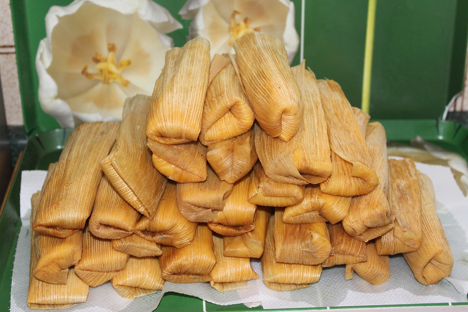 Tamales stacked upon eachother.