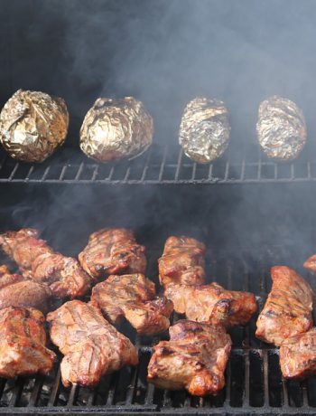 Food grilling on top and bottom sections of a grille.