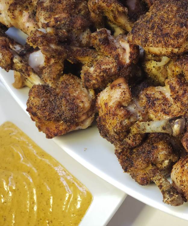 Chicken lollipops with a side of honey mustard.