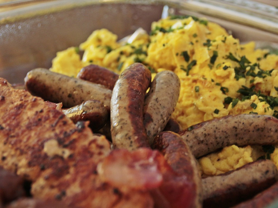 Sausage and eggs in a tray.