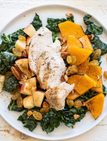 Autumn Chicken and Kale Salad prepared on a white dish.