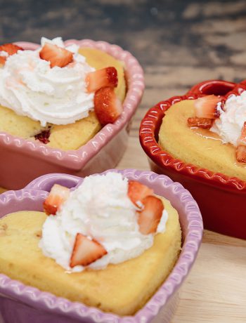 Heart-Shaped Strawberry Shortcakes with whipped cream and strawberry toppings.