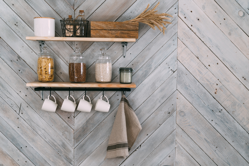 Modern shelving design holding kitchen products on a wooden wall.