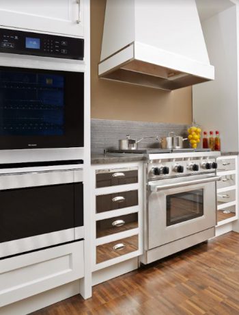 White kitchen design with mirrored cabinets.