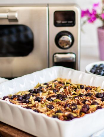 Square dish with blueberries and granola in a Sharp Countertop Oven.