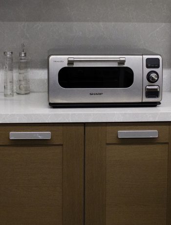 Sharp Countertop Oven on a top of a white countertop.