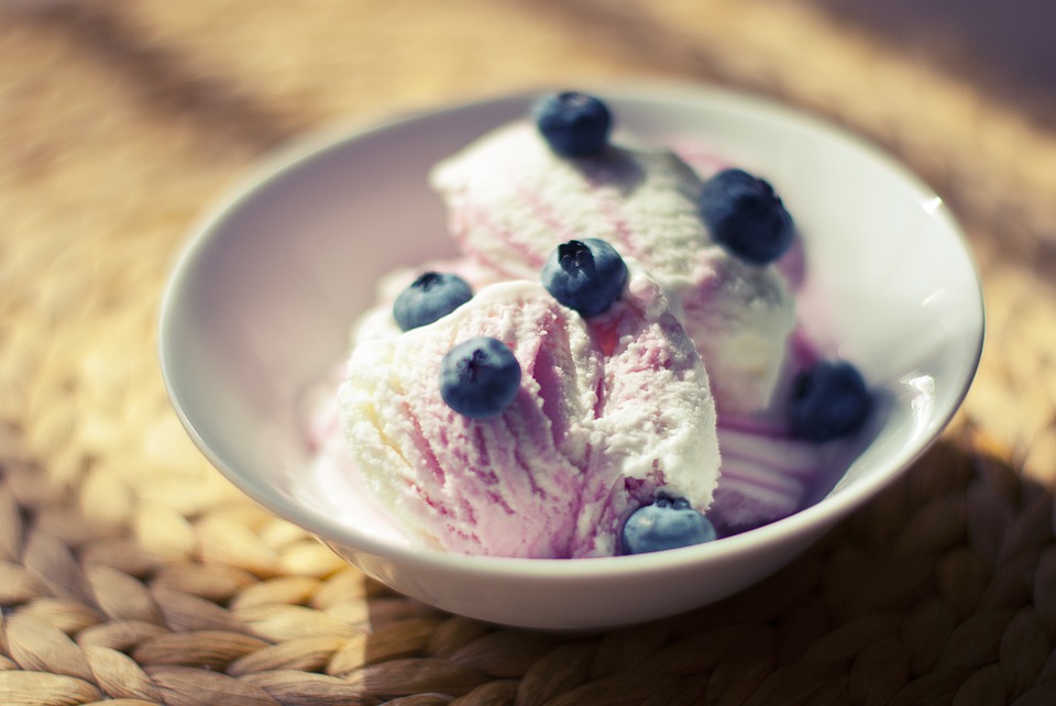 Ice cream with blueberries in a bowl.