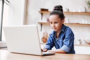 Child on a laptop computer in a computer.