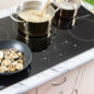 36-Inch Black  Cooktop (SDH3652DB) - preparing a meal on the Sharp 36” cooktop