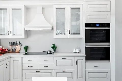 A modern white kitchen with a Sharp Built-In Double Wall Oven (SWB3062GS).