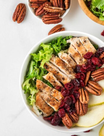 salad bowl with chicken, nuts and fruit