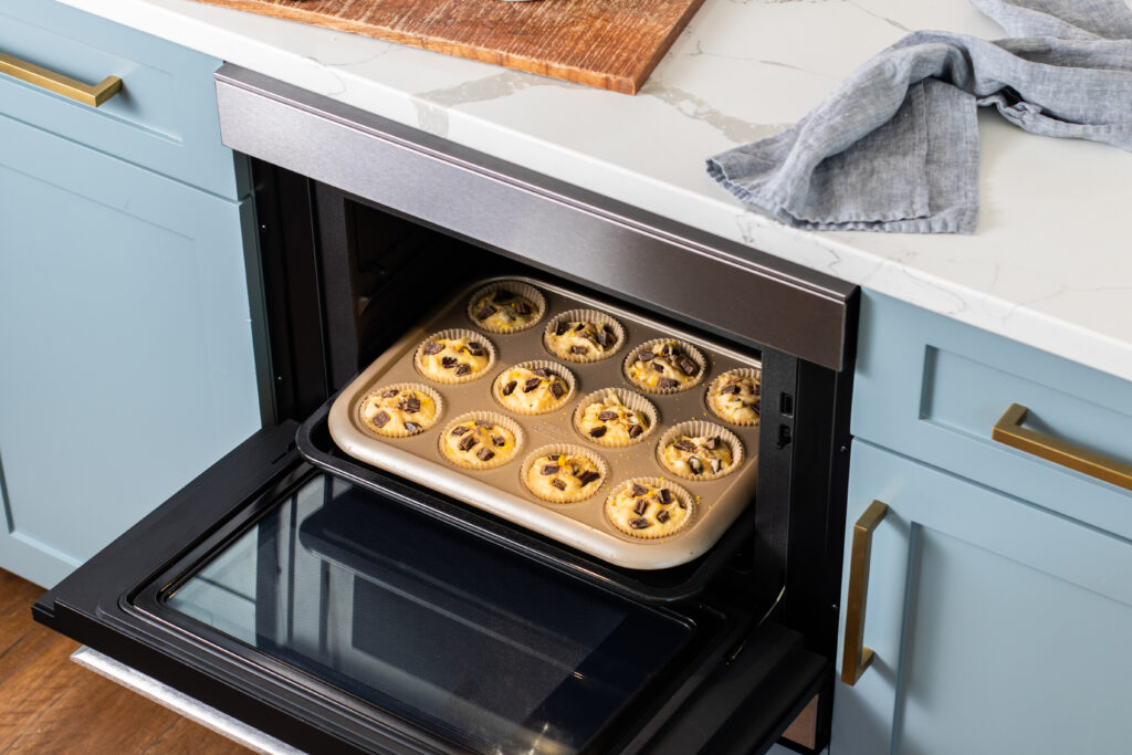 Muffins baking in a tin in a Sharp Superheated Steam Oven