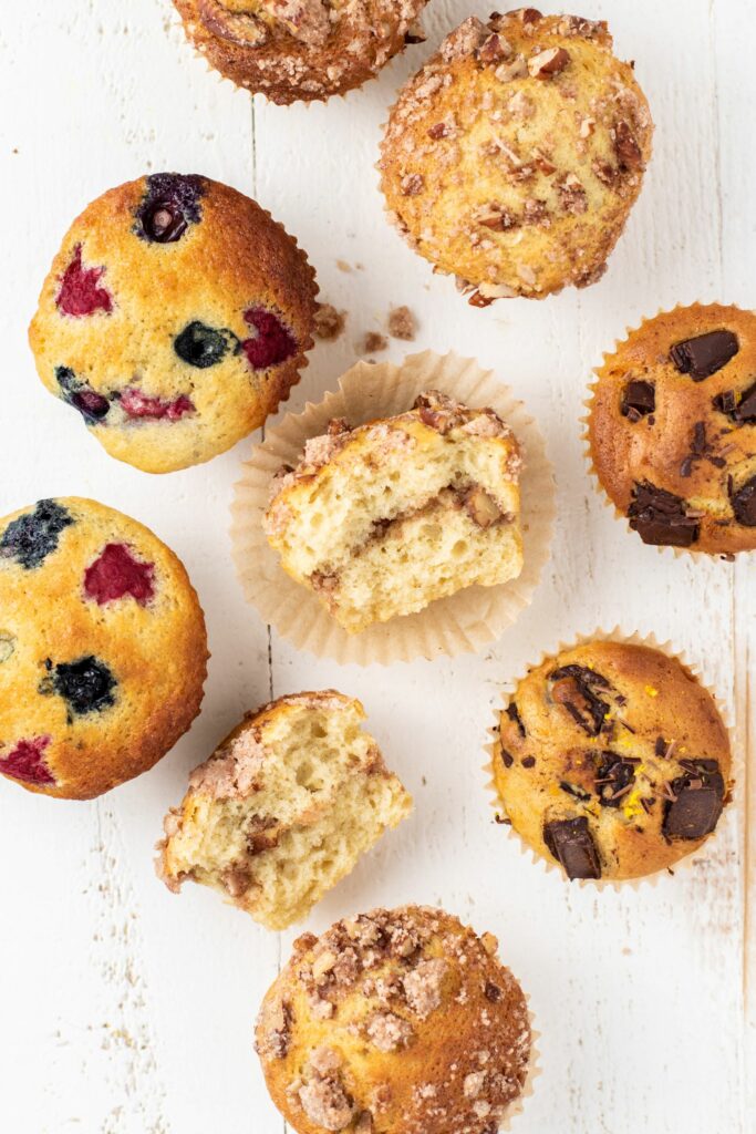 Muffins with 3 different mix-ins on a white background