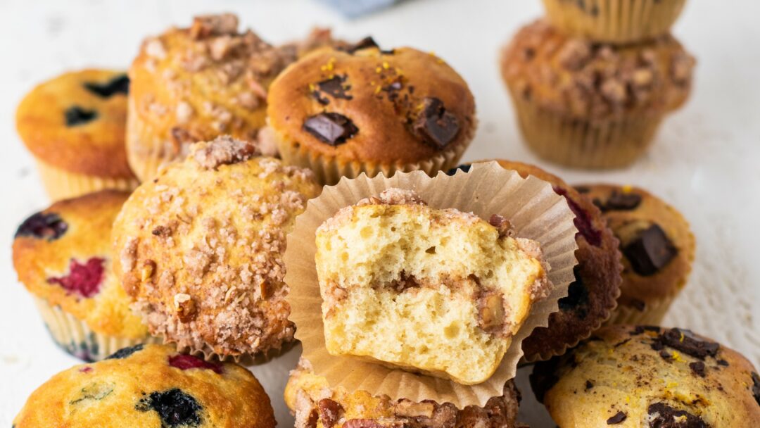 Arrangement of 3 baked muffins in a pile