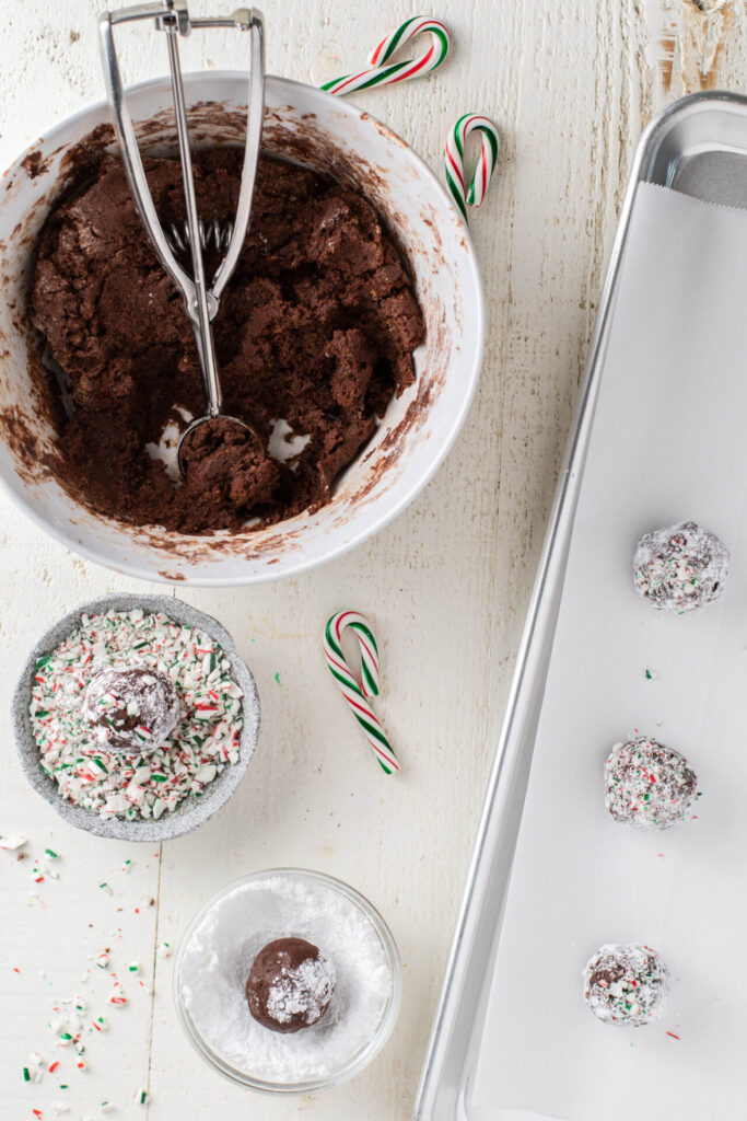 Chocolate crinkle batter, candy cane pieces and powdered sugar
