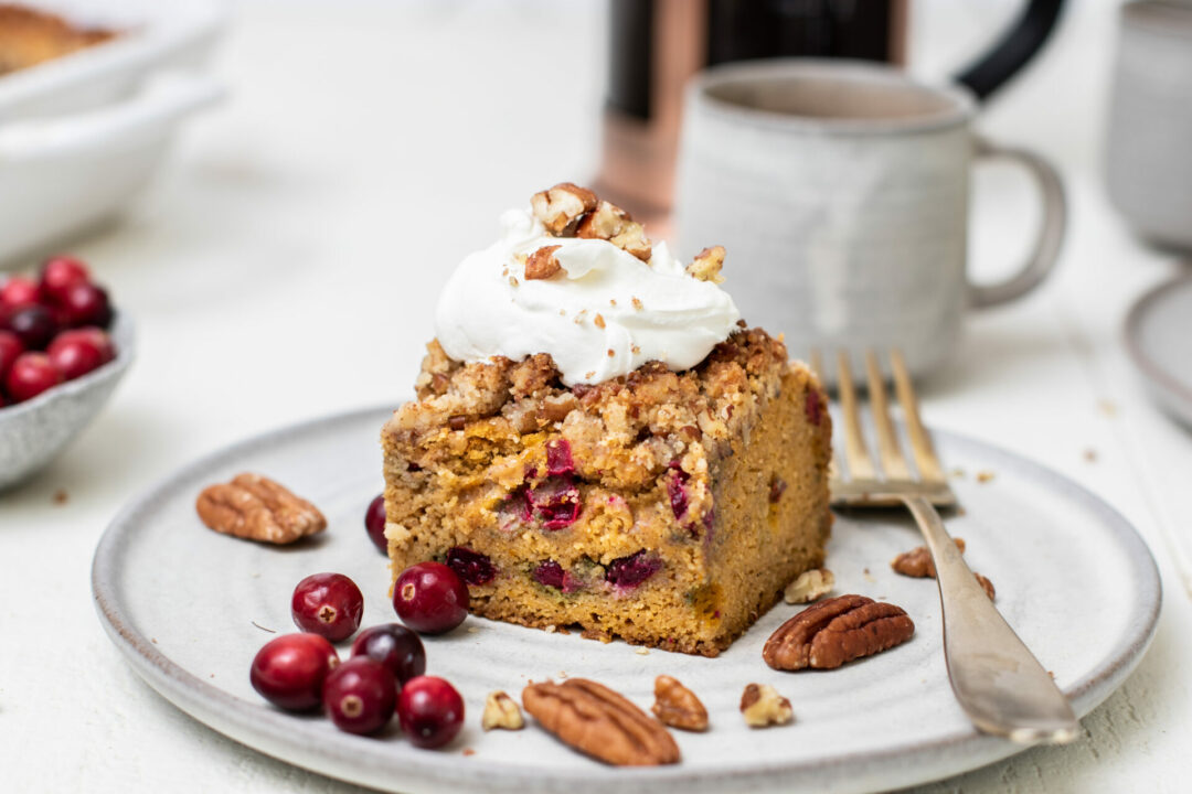 Pumpkin cranberry coffee cake with cranberries and pecan streusel topping