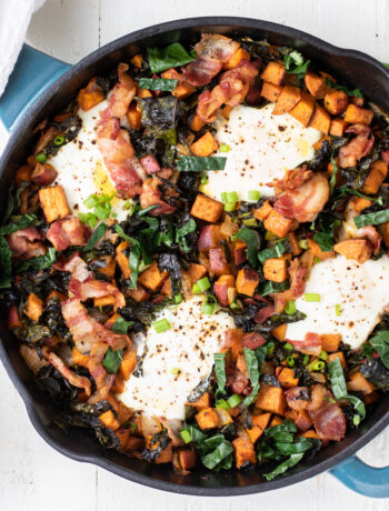 Sweet potato breakfast skillet on a white background with eggs