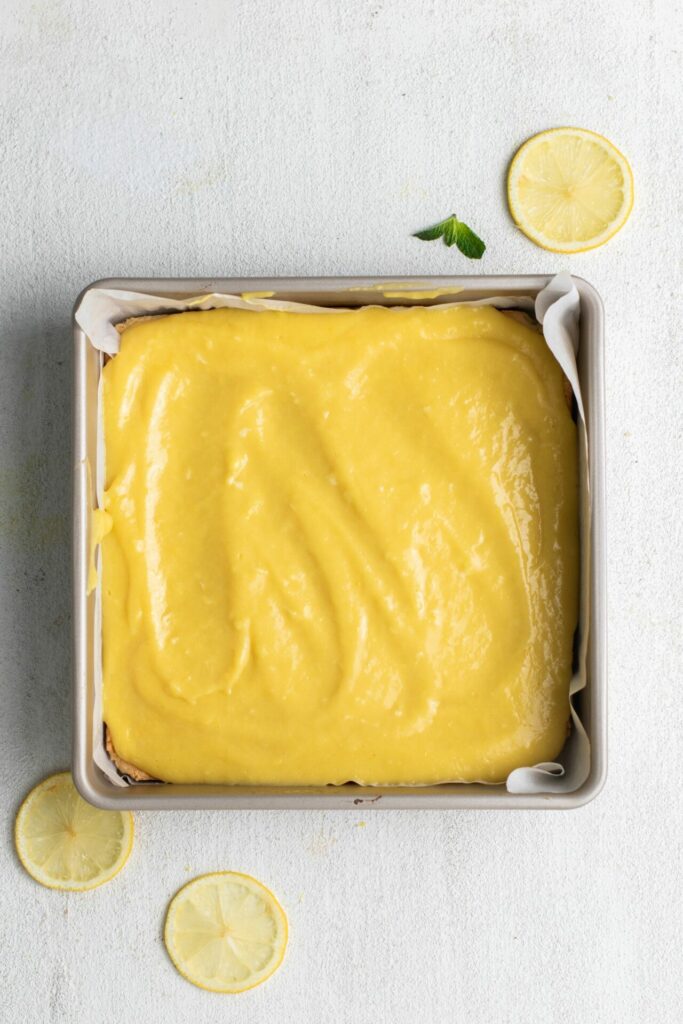 lemon custard in baking tin for lemon bars