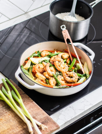shrimp stir fry cooking on sharp cooktop