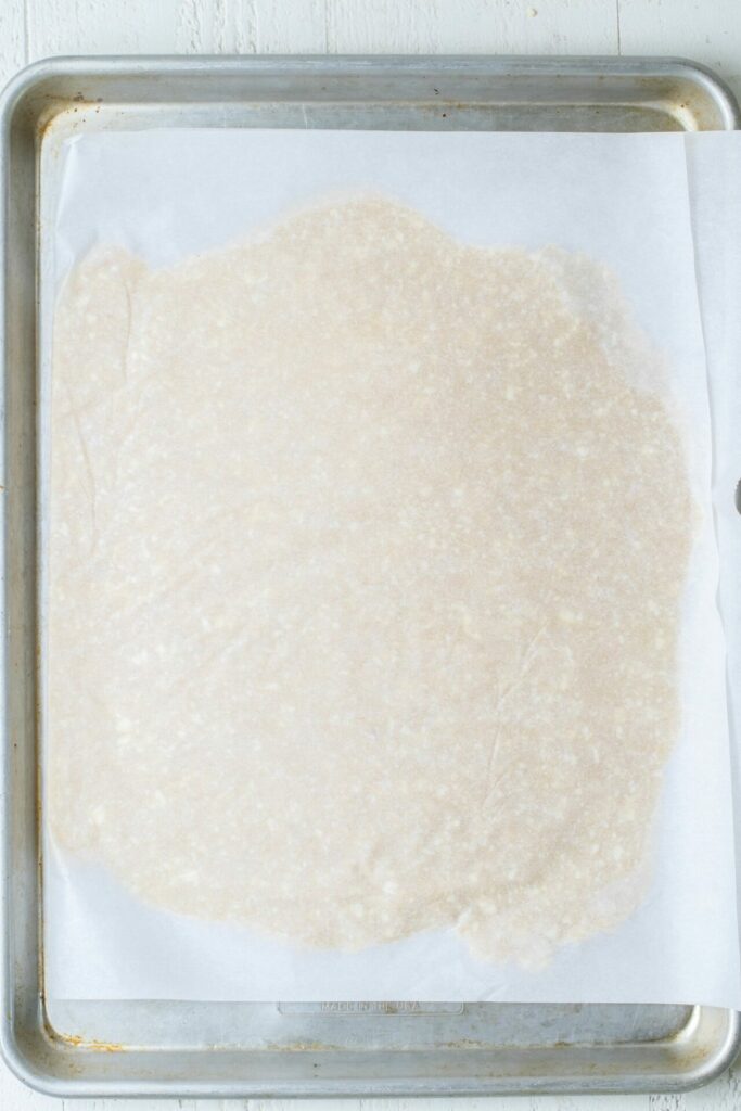 dough laid out with parchment paper