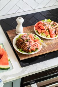 watermelon balsamic chicken salad on a plate on Sharp Induction Cooktop