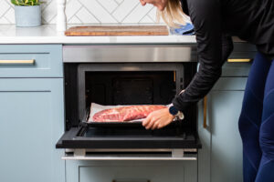Ribs being placed into Sharp SuperHeated Steam Oven