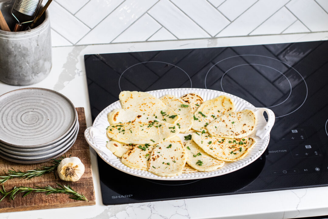 Flatbread on a serving dish on a Sharp Induction Cooktop