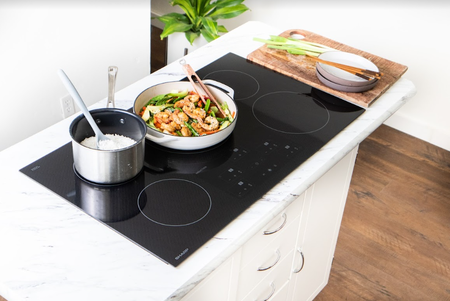 Induction cooktop with shrimp stirfry
