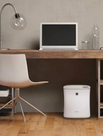 The Sharp True HEPA Air Purifier with Express Clean for Small Rooms (FPF30UH) in an office
