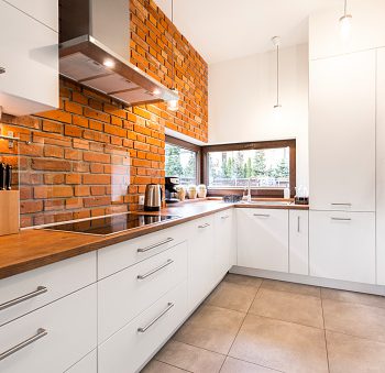 Modern designed kitchen with brick