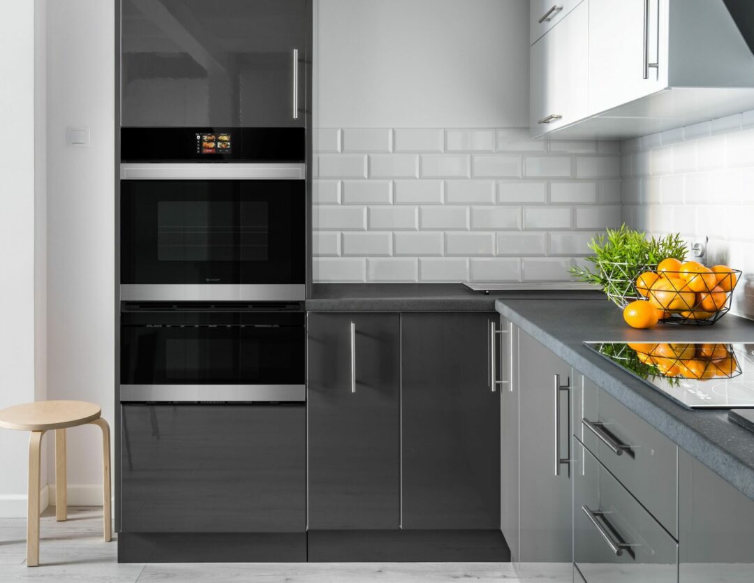 A Stainless Steel European Convection Built-In Double Wall Oven (SWB3052DS) in a modern gray kitchen.