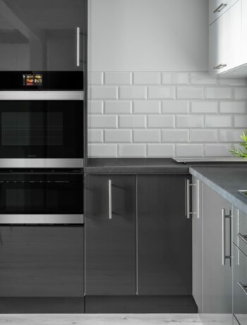 A Stainless Steel European Convection Built-In Double Wall Oven (SWB3052DS) in a modern gray kitchen.