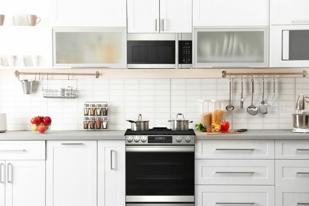A 30 in. Gas Convection Slide-In Range with Air Fry (SSG3061JS) in a bright, white, modern kitchen.