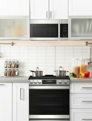 A 30 in. Gas Convection Slide-In Range with Air Fry (SSG3061JS) in a bright, white, modern kitchen.