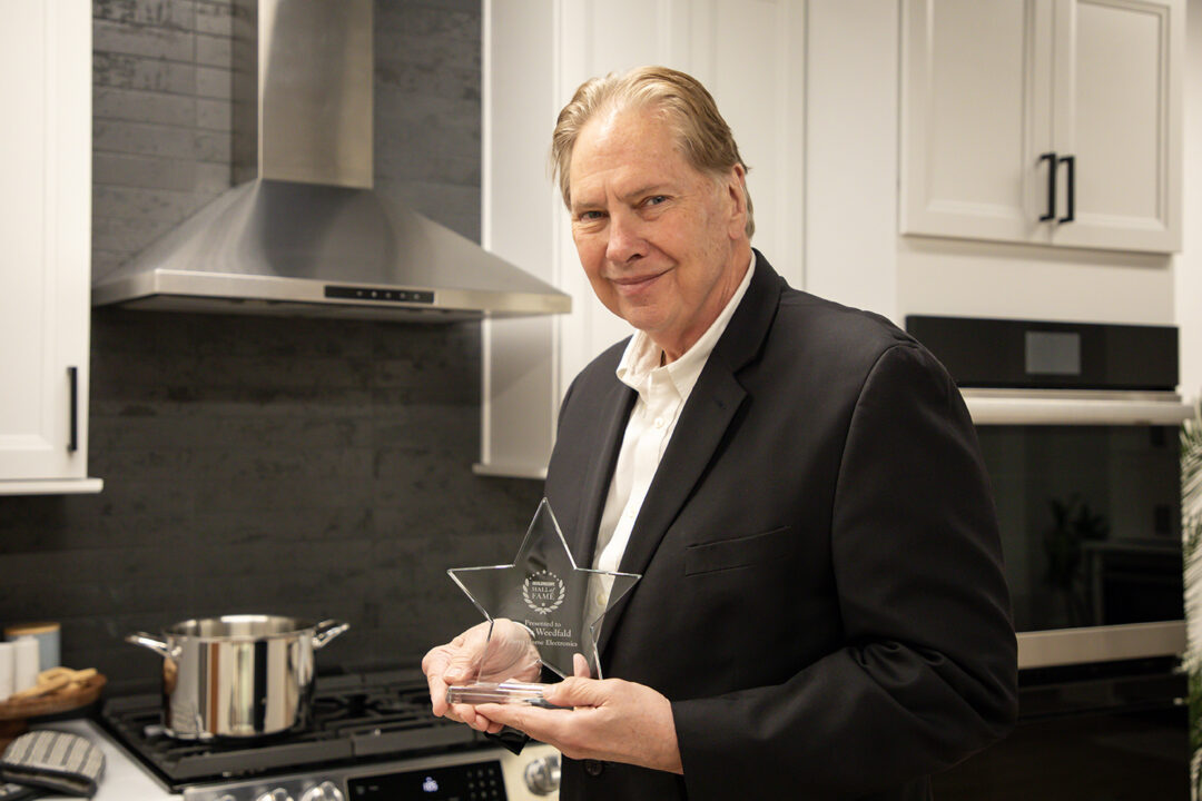 Peter Weedfald, Senior Vice President of Sales & Marketing, with the 2024 Dealerscope Hall of Fame Award.