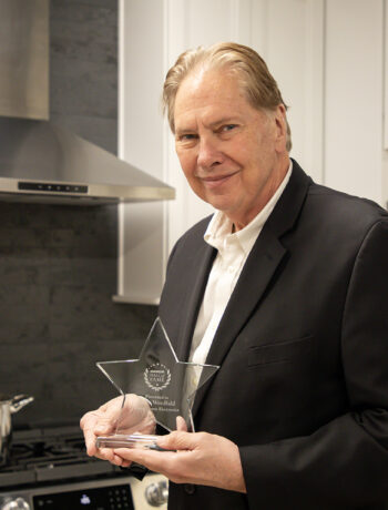 Peter Weedfald, Senior Vice President of Sales & Marketing, with the 2024 Dealerscope Hall of Fame Award.