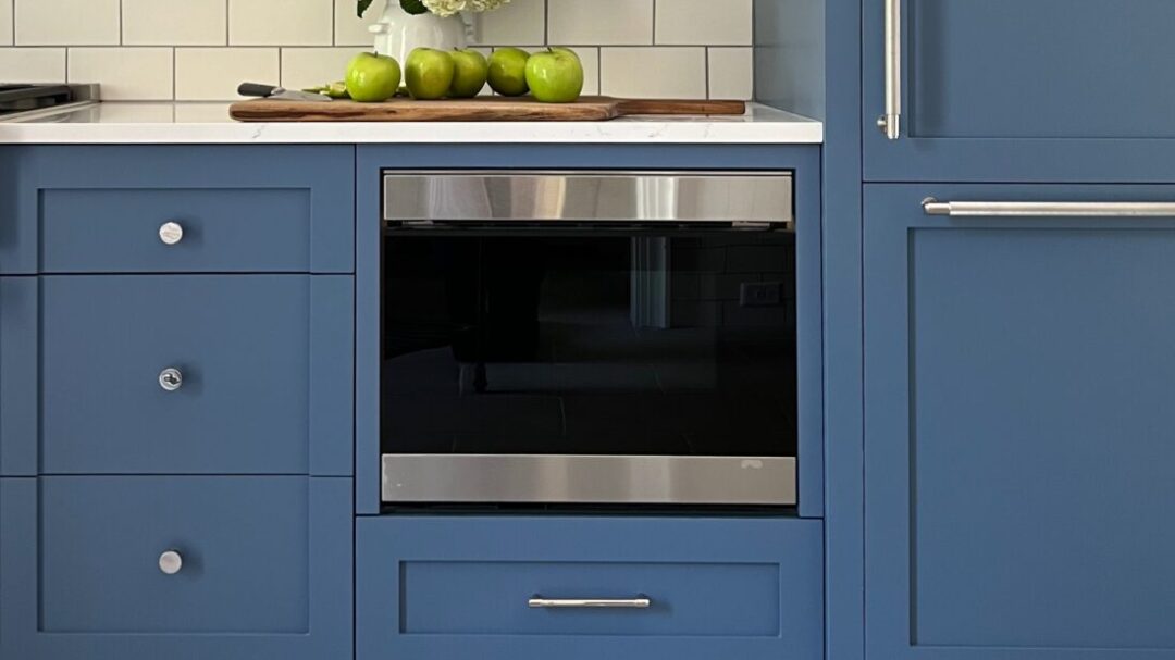 Sharp SMD2499FS in a modern kitchen with blue cabinets