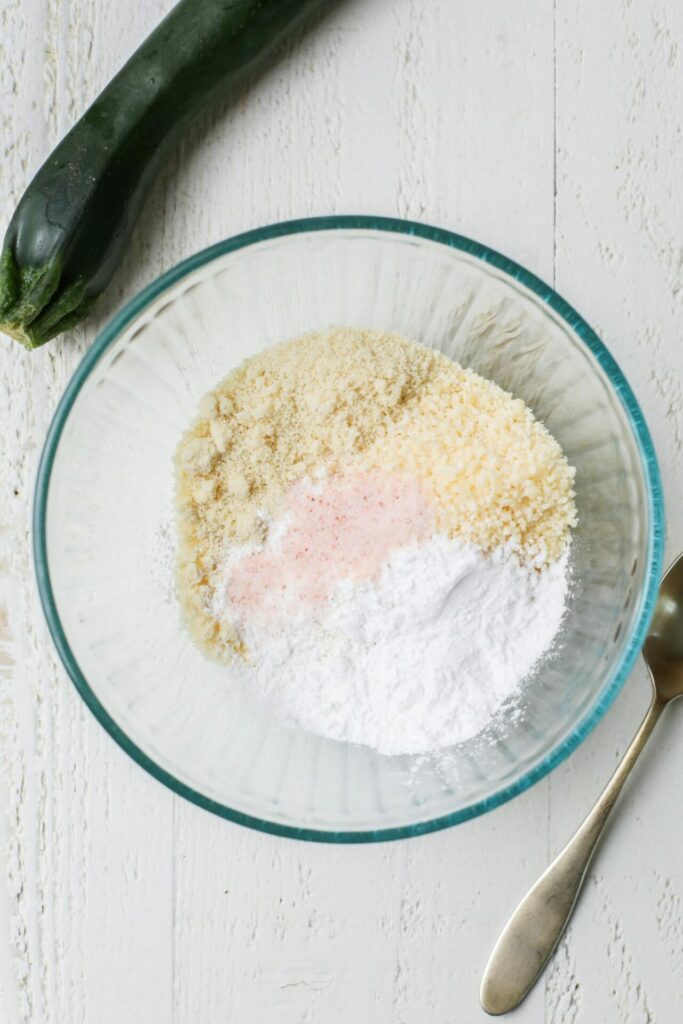 Dry ingredients for zucchini and corn fritters in a bowl