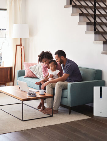 family in living room with air purifier