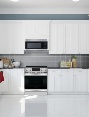 White kitchen design with grey backsplash.