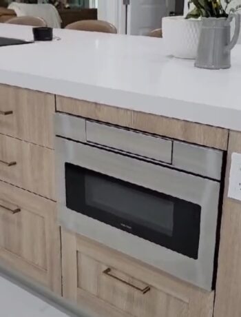 The Sharp Microwave Drawer Oven installed in a kitchen island.