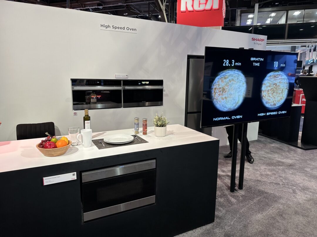 An image of Sharp's cES 2024 booth including the Sharp low-noise stick vacuum and hair dryer prototypes to the high-speed oven featuring proprietary Quad Heating Technologies