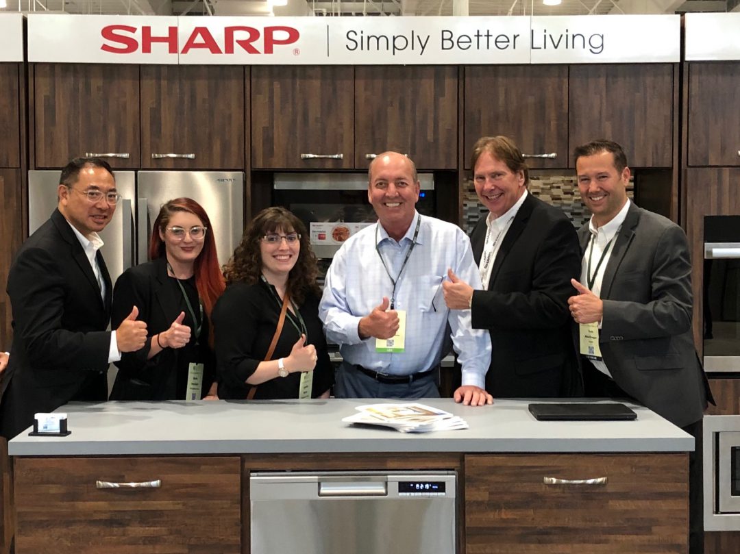 Sharp team at the NECO show at the Sharp booth.