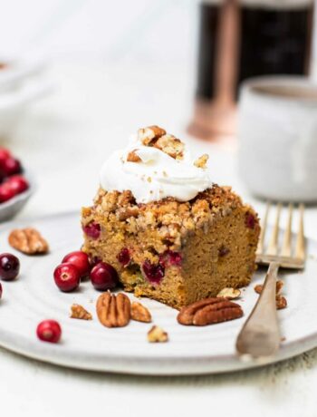 Pumpkin cranberry coffee cake with cranberries and pecan streusel topping