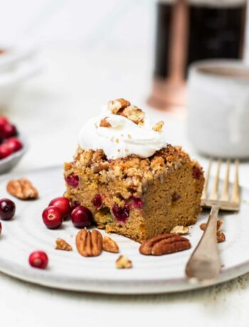 Pumpkin and cranberry coffee cake on a plate with a fork