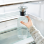 Sharp French 4-Door Counter-Depth Refrigerator (SJG2351FS) – interior view of slide-in shelf with water bottle