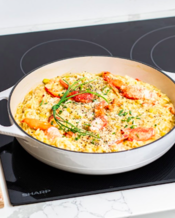 Lobster Risotto in a white dish on a SHARP Cooktop