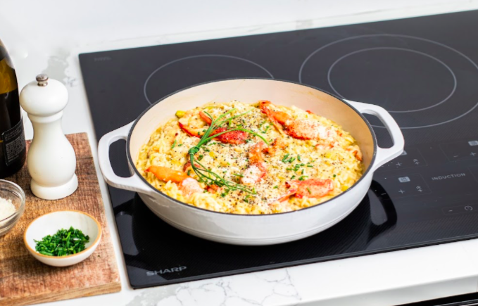 Lobster Risotto in a white dish on a SHARP Cooktop