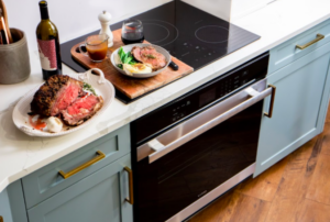 Prepared garlic and herb prime rib dinner in a bowl in a kitchen with Sharp appliances