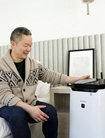 Danny Seo next to our Sharp Smart Plasmacluster Ion Air Purifier (FXJ80UW).